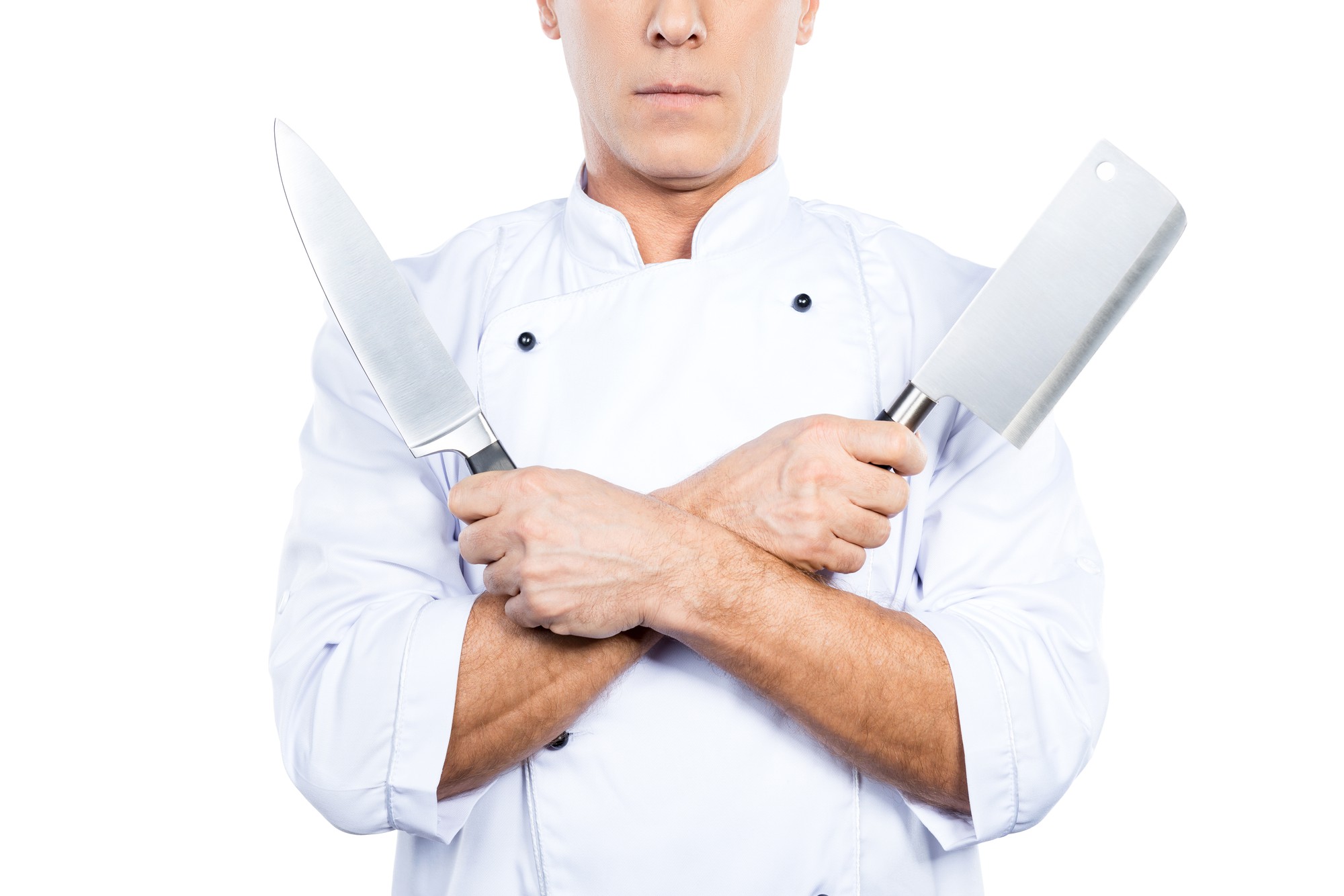 Chef che dimostra una tecnica di taglio davanti alla camera